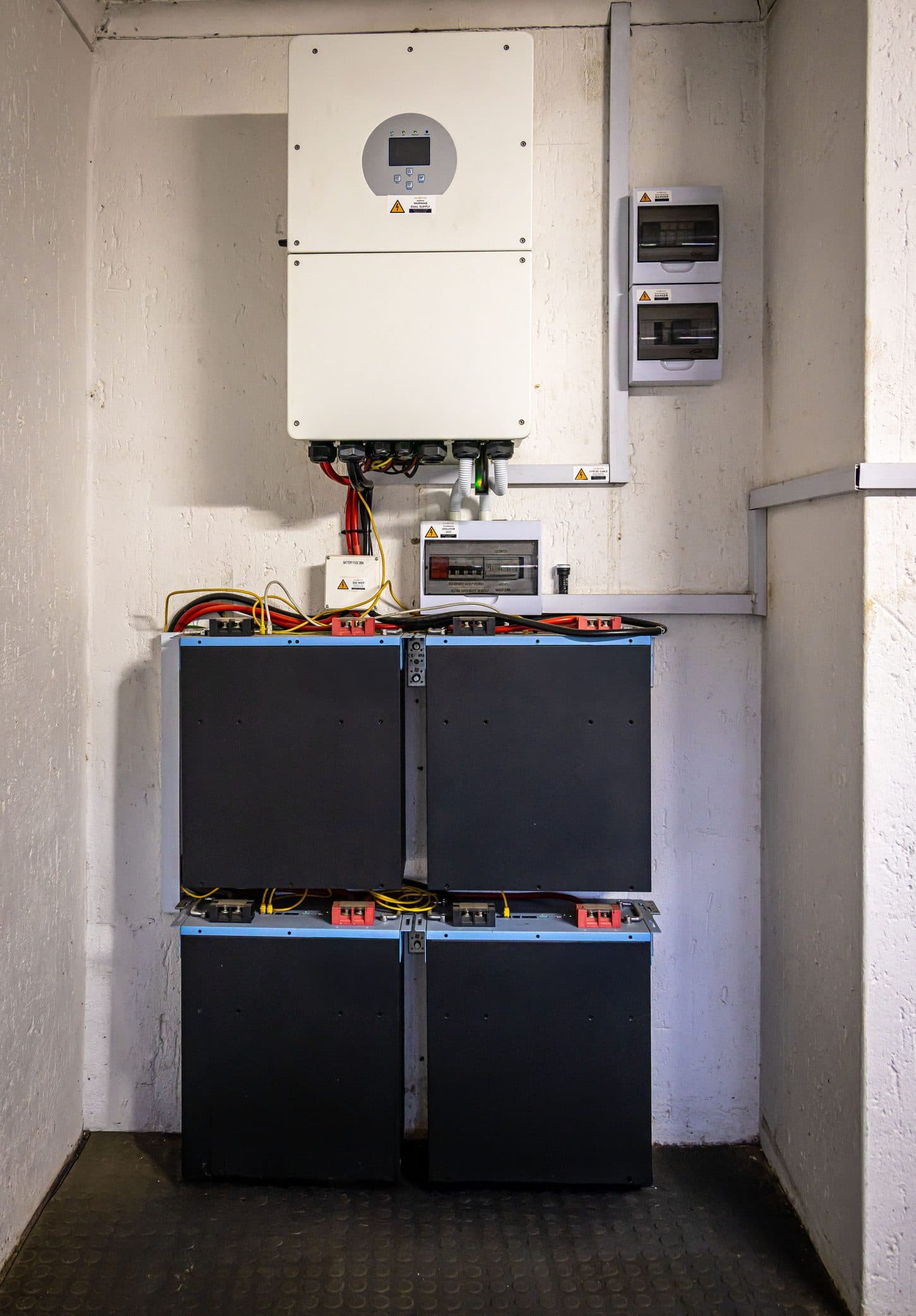 Stacked lithium battery modules wired into a building's storage system
